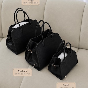 May include: Three black structured handbags in large, medium, and small sizes. The large bag measures 17 inches wide by 12 inches high by 10 inches deep. The medium bag is 15 inches wide by 11 inches high by 9 inches deep. The small bag is 12 inches wide by 9 inches high by 7.5 inches deep.