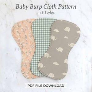 May include: Three contoured baby burp cloths featuring different patterns: a peach fabric with white floral stems, a green and white gingham check, and a taupe fabric with white elephant and cloud motifs. Text reads Baby Burp Cloth Pattern In 3 Styles PDF FILE DOWNLOAD.