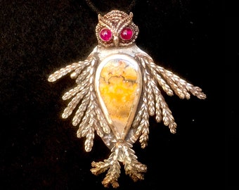 Silver feathered owl with jasper and ruby eyes