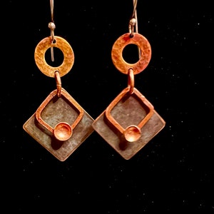 May include: A set of three ceramic mugs with a speckled, matte finish. The mugs are in shades of cream, light brown, and dark brown. Each mug has a simple, minimalist design, perfect for coffee or tea.