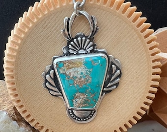 Turquoise and silver romantic style pendant for a special occasion.