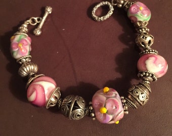 Lovely Floral bracelet made with handmade glass beads and beautiful sterling beads. 7 inches B-6