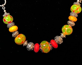 Perfect for fall. Orange and olive custom glass beads with sterling silver. 7" bracelet B3