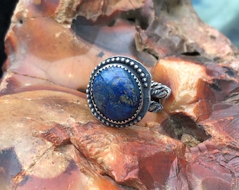 Deep blue and sterling silver make a stunning combination in this little ring.