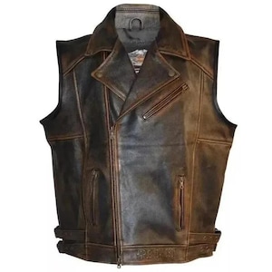 May include: A brown leather vest with a classic biker style. The vest features a notched collar, asymmetrical zipper closure, and multiple pockets. It has a distressed finish and adjustable waist straps. The vest is sleeveless.