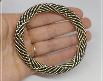 Black, golden, bead crocheted bracelet , bangle bracelet, pull over bracelet , geometric pattern, beaded bracelet