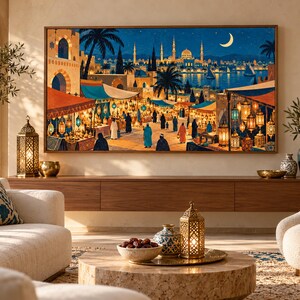 May include: A rectangular wall art print depicting a vibrant night market scene with colourful stalls, glowing lanterns, and a distant cityscape featuring a mosque and a crescent moon. The artwork is framed in wood and displayed above a wooden console table.