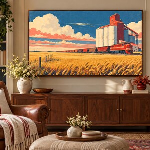 May include: A rectangular wall art print featuring a vibrant landscape painting of a red freight train passing by tall white grain silos. The scene includes a vast golden wheat field under a blue sky with large white and pink clouds.