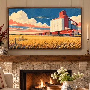 May include: A rectangular wall art print featuring a landscape painting of a red train traveling past a large white grain elevator in a golden wheat field under a blue sky with white clouds, framed in a thin brown border above a stone fireplace.