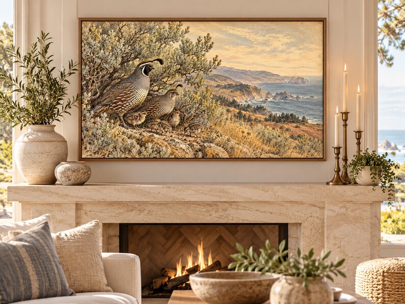 May include: A rectangular framed wall art print featuring a detailed landscape painting of a family of California quail perched on a rocky hillside overlooking a coastal ocean scene with cliffs, rolling hills, and a soft, golden-toned sky.
