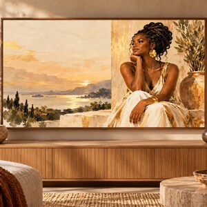 May include: A rectangular television screen displaying a digital painting of a person with dark hair in an updo, wearing a light-colored dress, sitting near a stone wall. The background shows a coastal landscape at sunset with golden light.