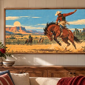 May include: A rectangular wall art print featuring a cowboy riding a bucking brown horse in a desert landscape. The scene includes a bright sun, red rock mesas, a wooden fence, and two other riders in the background under a blue sky.