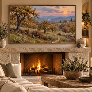 May include: A rectangular landscape painting in a thin brown frame depicting an orchard with golden-hued trees, a winding dirt path, and a stone wall under a sunset sky, mounted above a stone fireplace with a burning fire and a wooden coffee table.