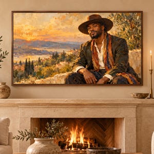 May include: A rectangular framed wall art print featuring an oil painting of a person wearing a wide-brimmed hat, a dark jacket, and a colorful scarf. The subject is positioned against a landscape background with a sunset sky, rolling hills, and trees.