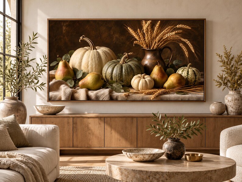 May include: A rectangular wall art print featuring a still life composition of various pumpkins, gourds, and pears arranged on a draped cloth. A dark copper pitcher filled with golden wheat stalks stands behind the fruit against a dark background.