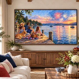 May include: A large rectangular wall art print depicting a family sitting on a wooden dock by a lake at sunset, with a golden retriever, a picnic basket, and fireworks in the sky. The scene features vibrant orange, blue, and yellow colors.