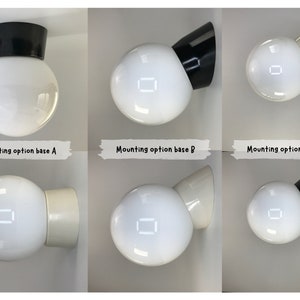 Op de afbeelding: Drie verschillende montageopties voor een witte bolvormige lamp. De eerste optie heeft een zwarte plafondbevestiging, de tweede optie heeft een zwarte wandbevestiging en de derde optie heeft een witte wandbevestiging met een trekkoord.