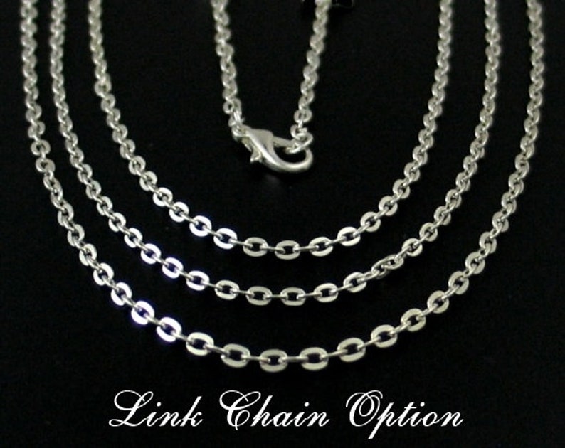 May include: Three silver chain necklaces with a lobster clasp closure. The chains are layered on top of each other, with the thickest chain on the bottom and the thinnest chain on top. The chains are all the same length.  Link Chain Option.