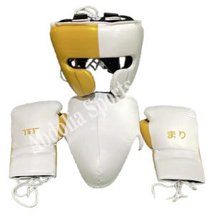 May include: A white and gold boxing helmet, chest protector, and gloves set. The helmet and gloves have the text "TGS" and Japanese characters. The gloves are laced. The set is designed for martial arts training and competition.