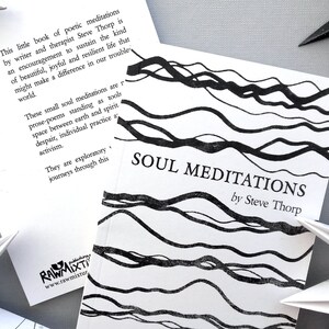 May include: A black and white book titled "Soul Meditations" by Steve Thorp. The cover features a black and white abstract design of wavy lines.