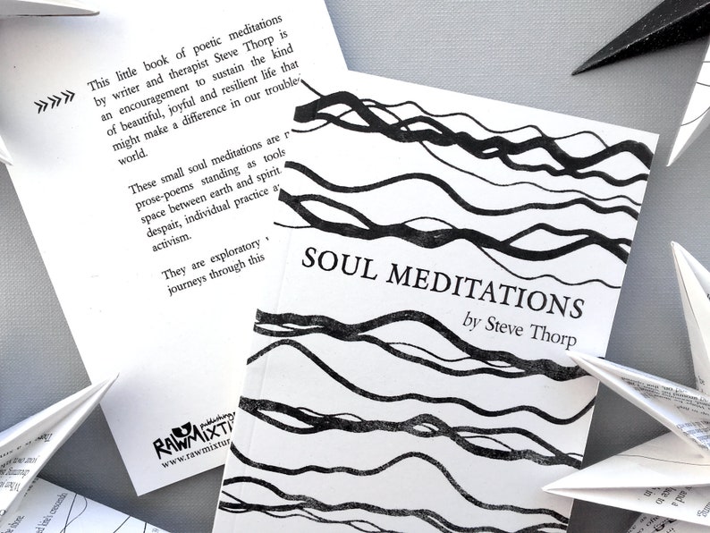 May include: A black and white book titled "Soul Meditations" by Steve Thorp. The cover features a black and white abstract design of wavy lines.
