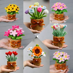 May include: A white ceramic mug with a black handle and the text "But First, Coffee" in a handwritten style. The mug is on a white surface. The mug is approximately 10 cm tall.