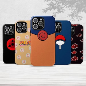 May include: A collection of five phone cases with various designs. The cases feature a black case with a red symbol, a tan case with the word "NARUTO", a blue and orange case with a spiral, a blue case with a white symbol, and a black case with red clouds.