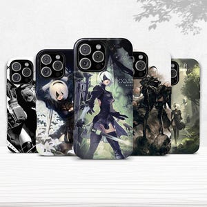 May include: Five phone cases with various designs. Each case features a character with white hair and a black outfit. The cases have a black camera module and different backgrounds, including a forest and abstract designs.