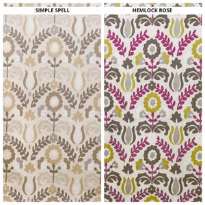 Può includere: Due campioni di tessuto con motivi floreali. Il campione "Simple Spell" presenta un design beige e marrone. Il campione "Hemlock Rose" ha uno sfondo bianco con elementi floreali rosa, gialli e marroni. I testi "SIMPLE SPELL" e "HEMLOCK ROSE" sono visibili.