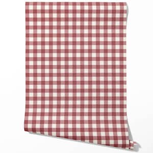 May include: A roll of wallpaper with a red and cream gingham check pattern. The design is a classic, repeating square pattern, reminiscent of a picnic blanket. The roll is partially unrolled, showing the pattern.