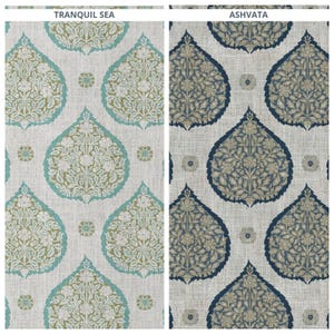 May include: Two fabric swatches with repeating patterns. The left swatch is labeled "TRANQUIL SEA" and features a teal and olive green floral design on a light background. The right swatch, labeled "ASHVATA", has a navy and beige floral pattern.