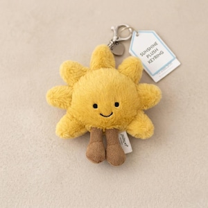 Sunshine pluche sleutelhanger – zacht lachende zontasbedel, kawaii speelgoedhouder