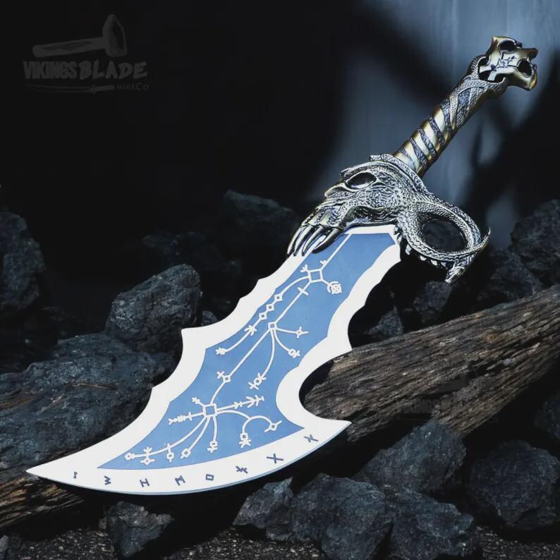 May include: A fantasy sword with a blue and white blade. The hilt and guard have detailed silver-coloured dragon and skull designs. The blade features white markings. The text "Vikings Blade" is visible on the image.