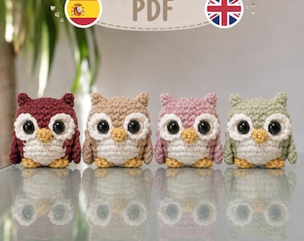 May include: Four small crocheted owl figures arranged in a row, each featuring large black safety eyes, a small yellow beak, and a white chest. The owls are colored in dark red, light brown, dusty pink, and sage green, with a PDF label above them.