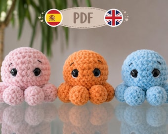 May include: Three crocheted octopus plush toys in light pink, orange, and light blue. Each plush features a round head, multiple small tentacles, and large black safety eyes with white highlights. A beige oval label above reads PDF.