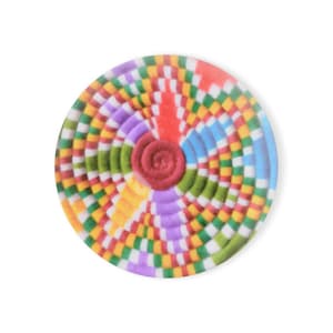 May include: A round, colorful coaster with a spiral design. The center features a raised, reddish-brown spiral. The coaster has concentric rings of color, including red, orange, yellow, green, blue, and purple, with a checkered pattern.