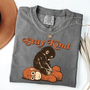 May include: A rustic wooden sign with the text "Welcome to our home" in white lettering. The sign features a distressed finish and a simple, inviting design, perfect for a front porch or entryway.