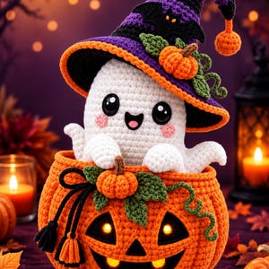 May include: A white crocheted ghost figure with large black eyes and pink cheeks, wearing a purple and black pointed hat with a small orange pumpkin. The ghost sits inside a large orange crocheted pumpkin with a carved face and glowing lights.