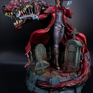 Peut inclure: Figurine détaillée d'un personnage en manteau et chapeau rouges, tenant une arme à feu, avec une créature monstrueuse ressemblant à un loup. La figurine se dresse sur une base avec des pierres tombales et un liquide rouge, sur fond sombre.