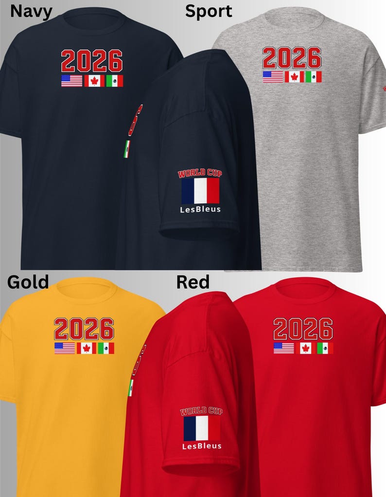 May include: A collection of short-sleeved t-shirts in navy, sport grey, gold, and red. Each shirt features the number "2026" in red, with the flags of the USA, Canada, and Mexico. Some shirts have "WORLD CUP" and "Les Bleus" on the sleeve.