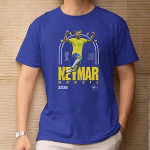 A blue t-shirt with a graphic design featuring a soccer player in a yellow jersey, along with text and a number.