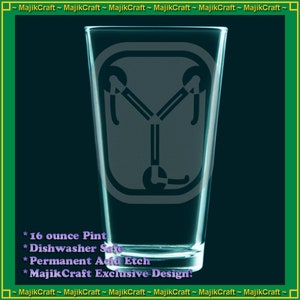 May include: A 16 ounce clear glass pint glass with a frosted etching of the DeLorean time machine from the movie Back to the Future. The text on the glass reads "16 ounce Pint", "Dishwasher Safe", "Permanent Acid Etch", and "MajikCraft Exclusive Design."