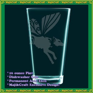 May include: A 16 ounce glass pint with a design of a wolf with wings etched into the glass. The text "16 ounce Pint", "Dishwasher Safe", "Permanent Acid Etch", and "MajikCraft Exclusive Design!" is printed on the glass.