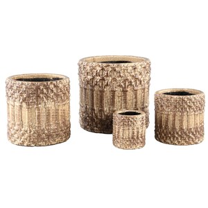 May include: A set of four cylindrical planters in varying sizes, featuring a textured, light brown and tan finish with a repeating vertical column pattern. Each planter has a wide, open top and a dark interior, showcasing a consistent design.