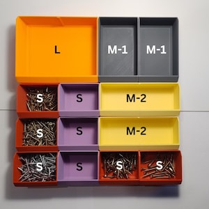 May include: A top-down view of a storage organizer with various colored bins. The bins are labeled with letters and filled with screws. The colors include orange, gray, red, purple, and yellow. The labels include "L", "M-1", "M-2", and "S".