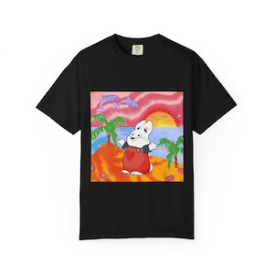 May include: Black t-shirt featuring a cartoon illustration of a white rabbit wearing red overalls with a heart on the chest, standing on a beach with palm trees, dolphins, and a sunset. The design is centered on the shirt.