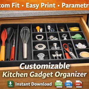 May include: A black kitchen gadget organiser with multiple compartments, shown inside an open wooden drawer. The organiser contains various kitchen tools, such as a whisk, spoons, and scissors. Text on the image reads "Customizable Kitchen Gadget Organizer."