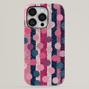 May include: A smartphone case featuring a vertical striped pattern in shades of navy blue, magenta, and light pink. The design is overlaid with a repeating pattern of solid and glittery polka dots in pink, magenta, and dark blue hues throughout.