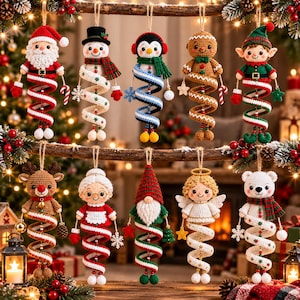 May include: A collection of ten crocheted Christmas ornaments featuring a Santa, snowman, penguin, gingerbread person, elf, reindeer, Mrs. Claus, gnome, angel, and polar bear, each with a spiraling body and hanging loop for display.