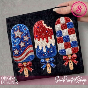 May include: Three decorative popsicle designs in red, white, and blue, with sparkling embellishments. One has a star pattern, another has a bite taken out, and the third has a checkerboard pattern. Each popsicle has a wooden stick and a decorative bow.